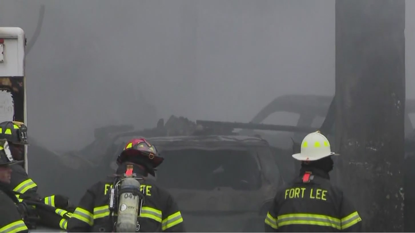 Crews battle three-alarm fire at auto shop – PIX11