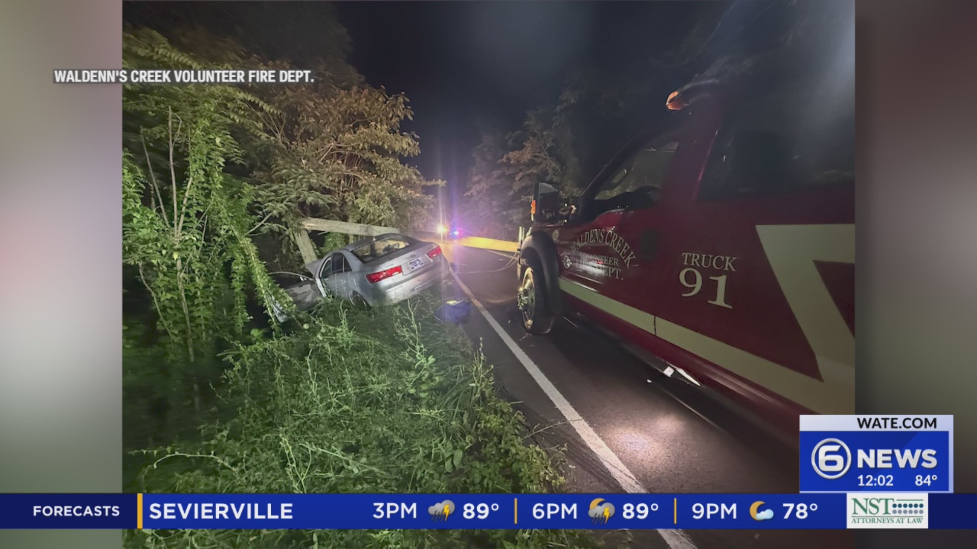 Driver rescued via rope after falling from embankment after crash in ...