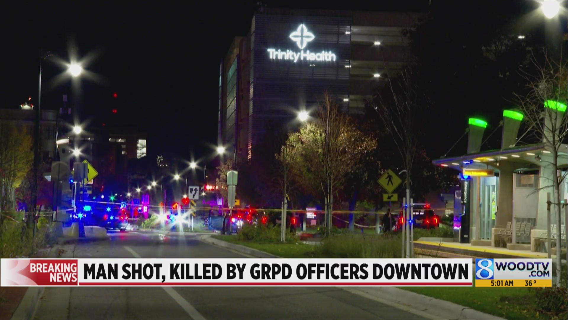 Man with gun shot by officers, killed near Trinity Health in Grand ...