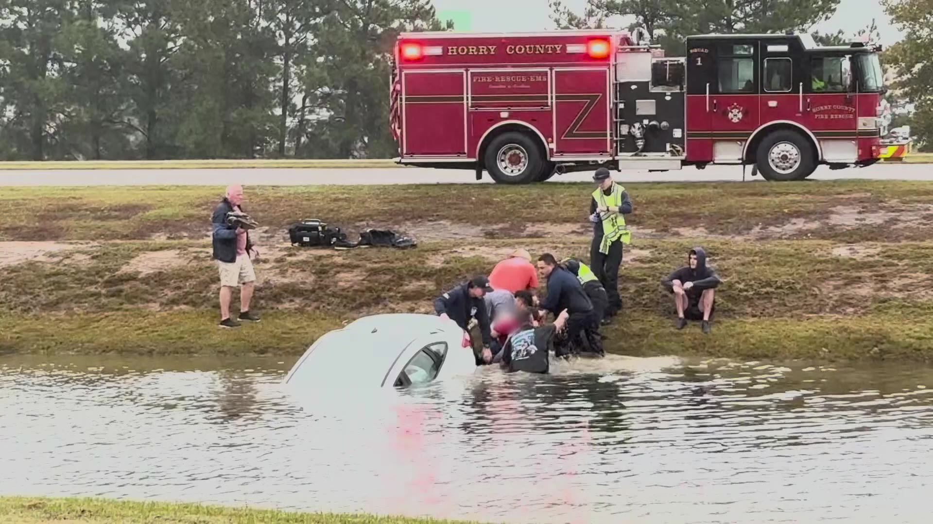 Video shows dramatic rescue of woman from car submerged in Horry County ...