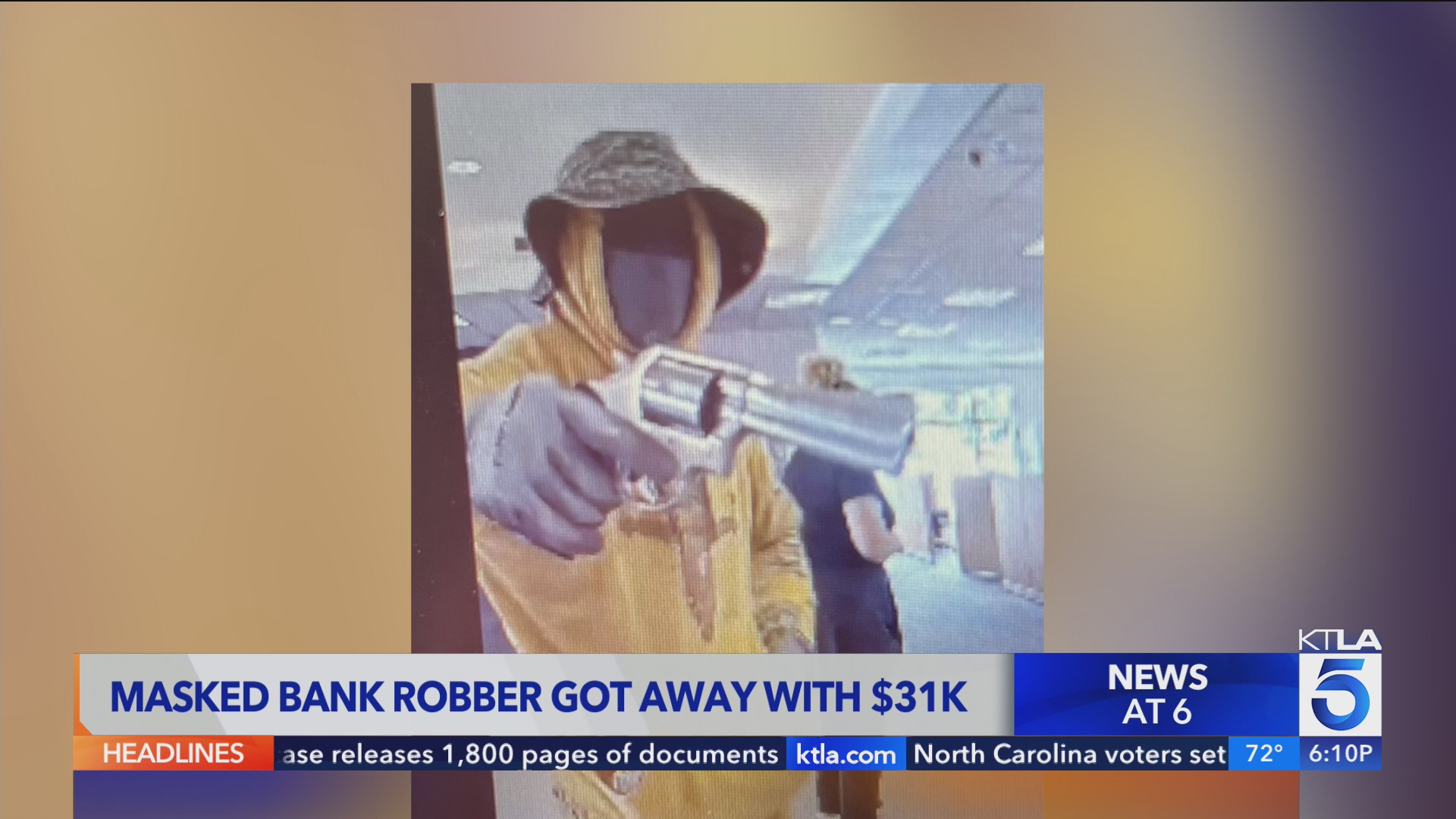 Authorities search for armed suspect in Orange County bank robbery – KTLA