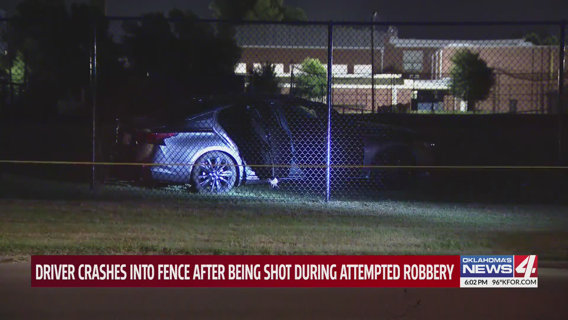 Driver crashes into fence after being shot during attempted robbery ...